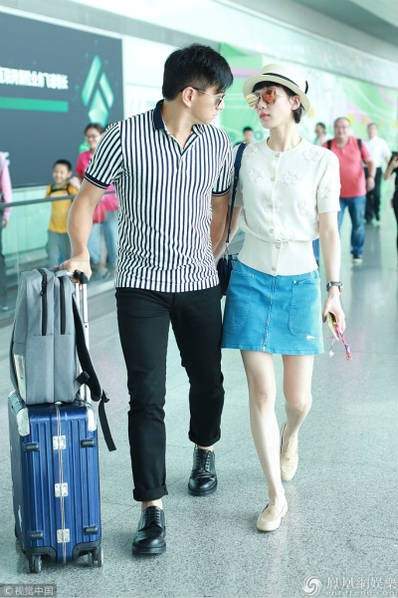 Lưu Thi Thi và Ngô Kỳ Long tình tứ tại sân bay giữa tin đồn ly hôn vì ngoại tình 7
