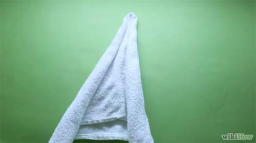 Cách xếp chim thiên nga bằng khăn tắm tô điểm cho giường cưới 12